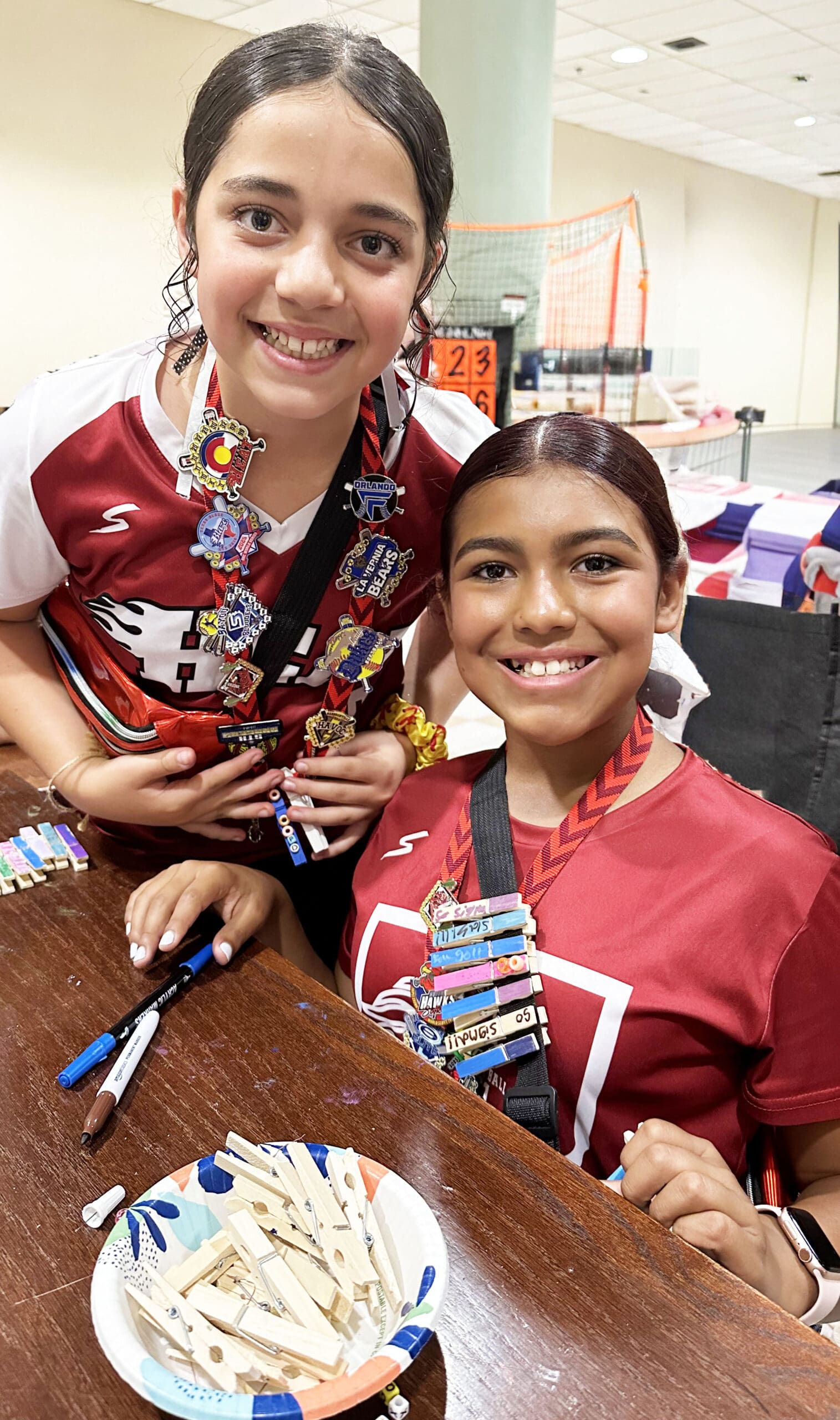 Players proudly display their trading pins during the TC OKC Player Party, a favorite tradition of the tournament.