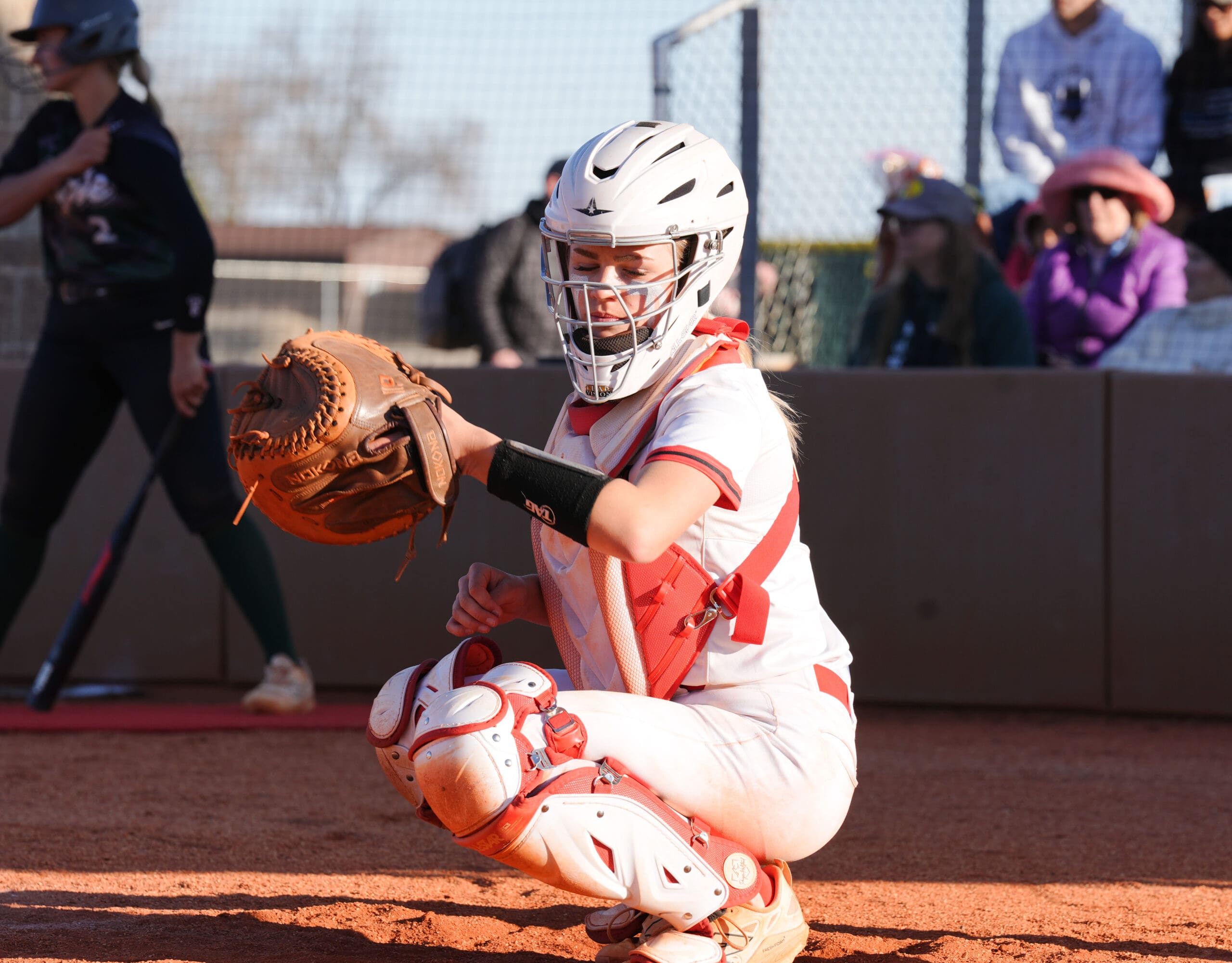 Haiylee Reeves, Storm catcher, prepares for the next pitch during the Salute to Service Game.