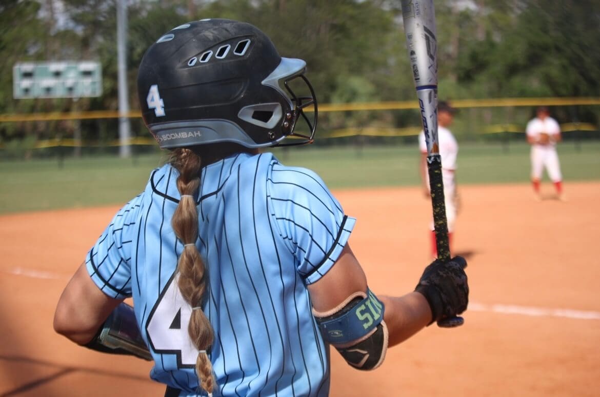 Alivia Artinis hitting during a game