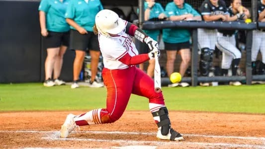 Kelly Horne drives the ball with power while maintaining a stable front side during a game at Troy University.