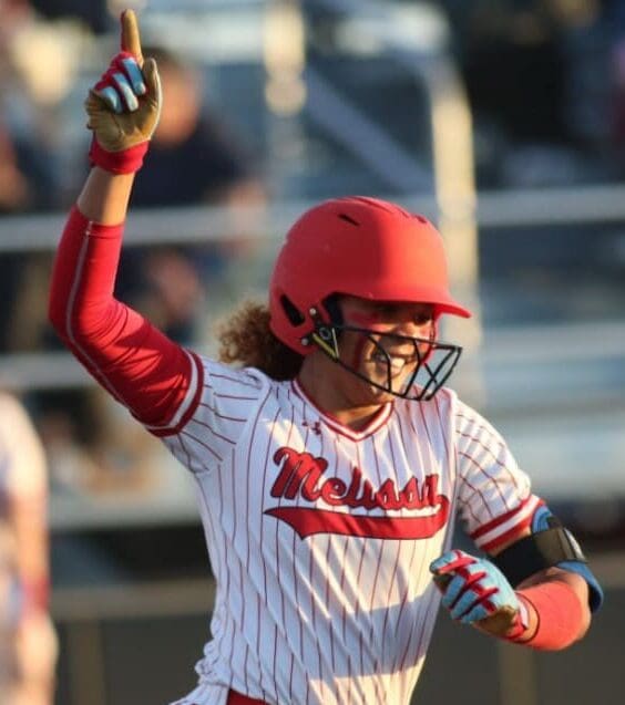 Kennedy Bradley rounds the bases after hitting a home run during a game.