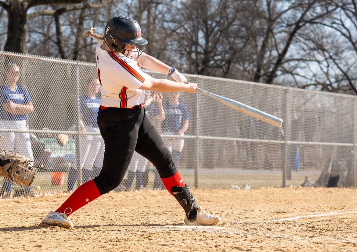Keagan Cooper puts a strong swing on a pitch during a game for Elizabeth Seton High School in Bladensburg, Md.