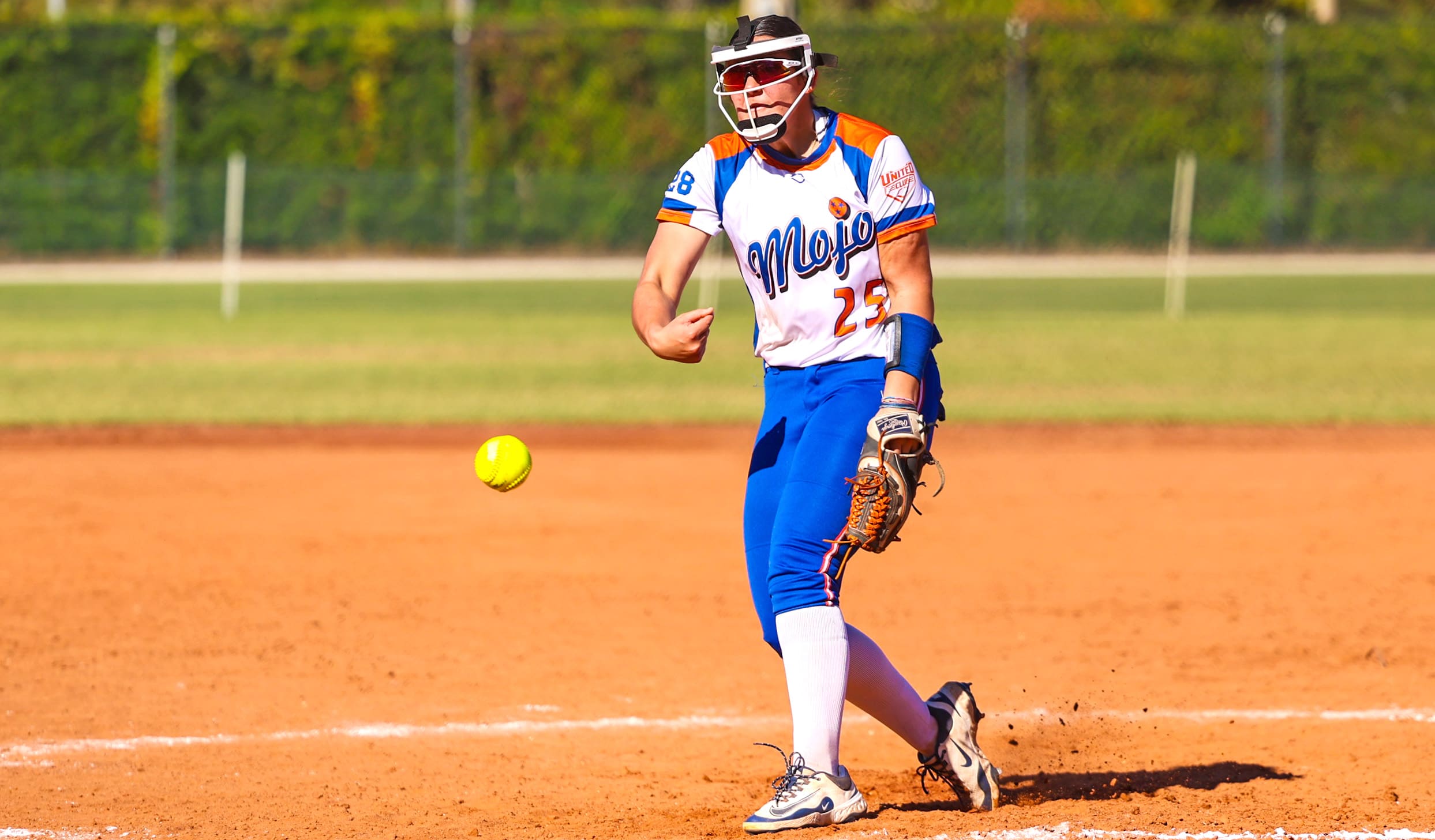A pitcher delivers during fall showcase play.