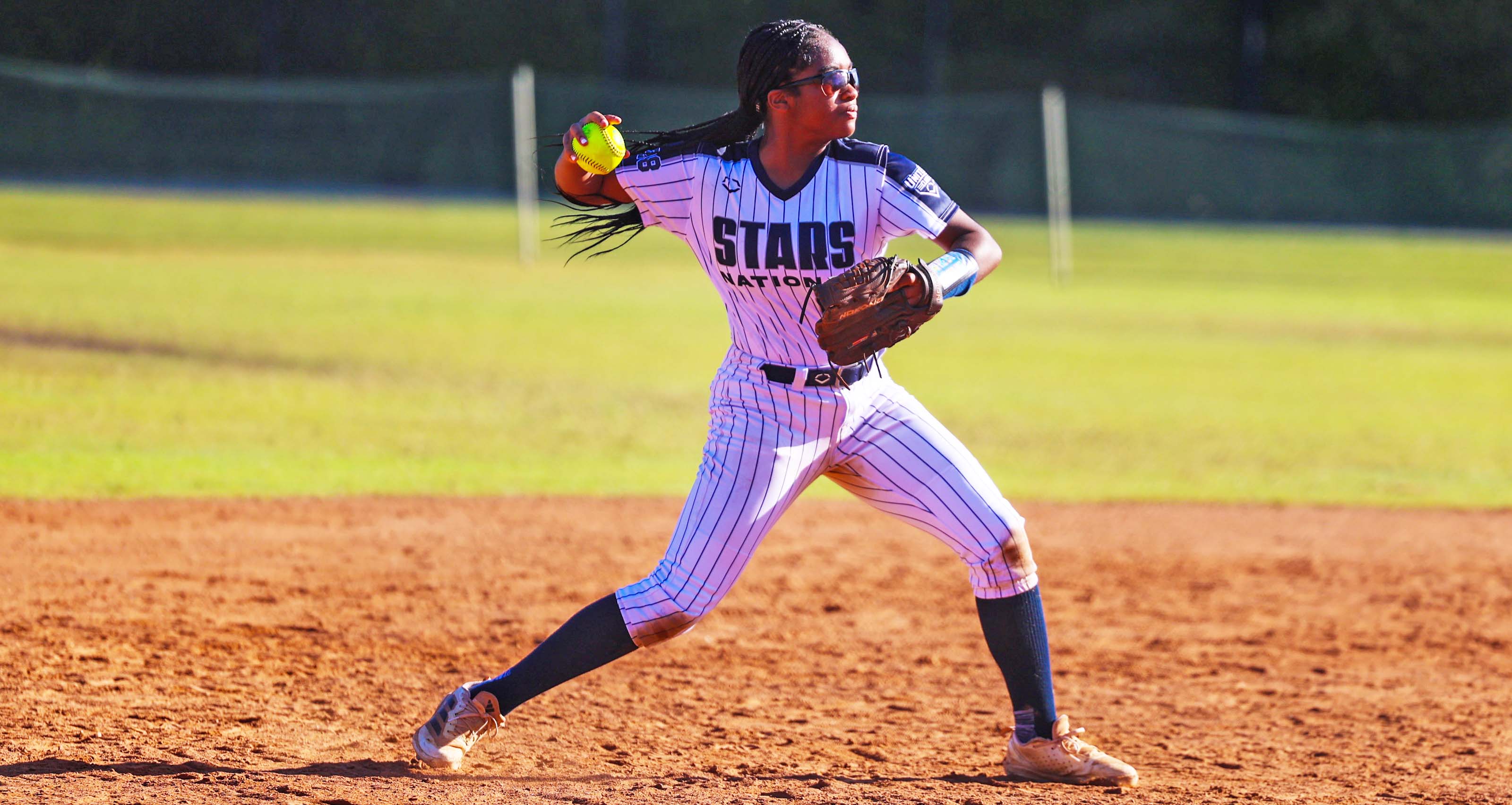 An infielder makes a throw during action at the Florida Fall Showcase.