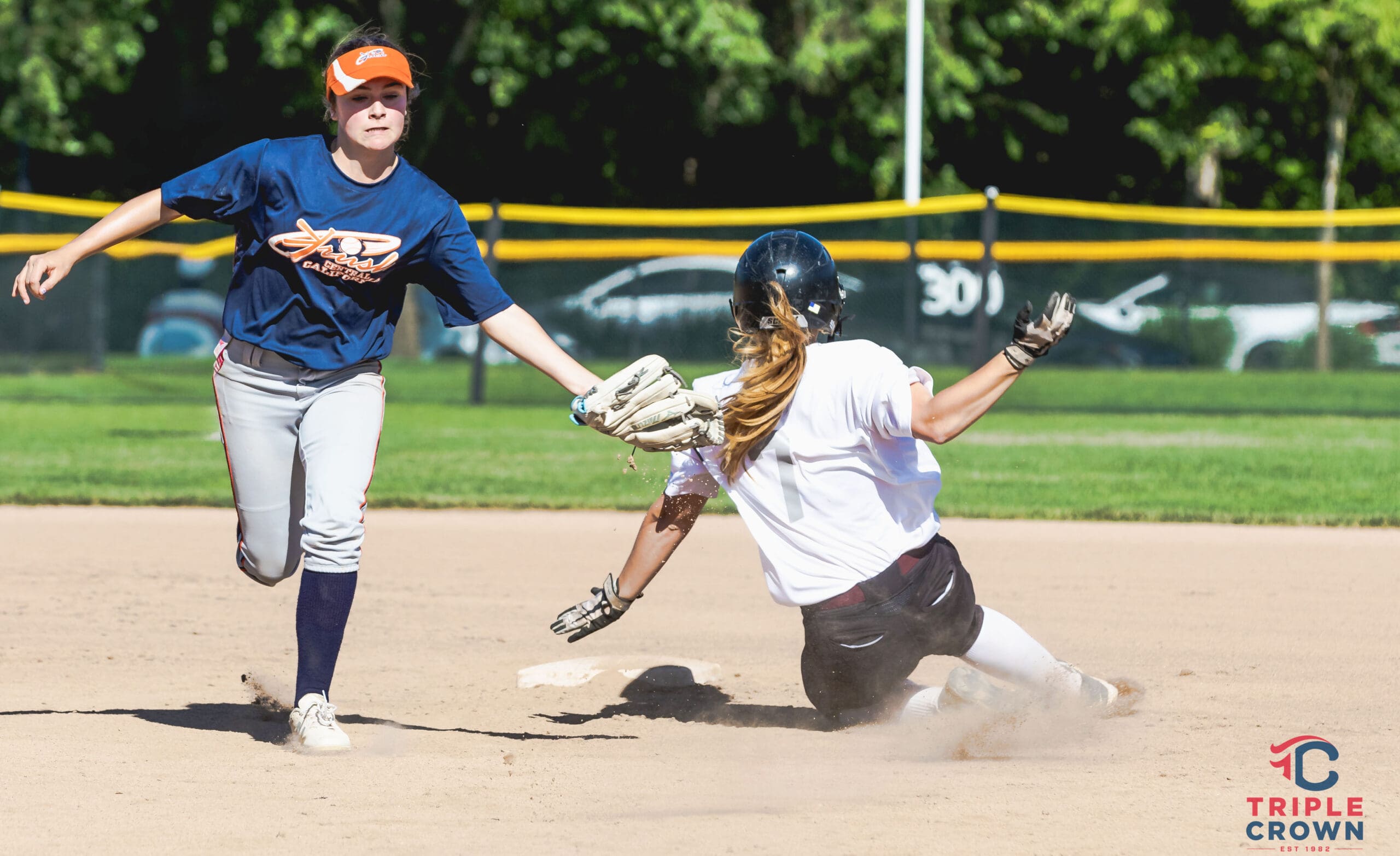 A runner slides safely as teams battle during fast-paced action at the Valley Invite.